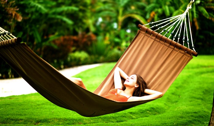 Young beautiful woman in hammock, Bali, Indonesia; Shutterstock ID 92736865; PO: aol; Job: production; Client: drone