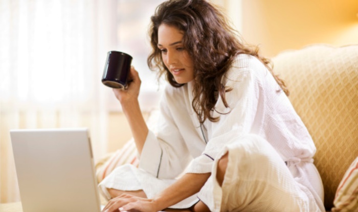 Woman working at home with laptop computer